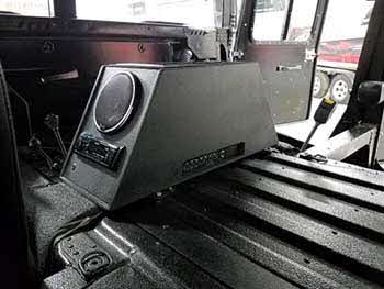 Hummer H1 (military model). Built a small basic center console to house Kenwood digital media receiver, a pair of 5.25" coax speakers and an amplifier with a storage area. Also custom built a subwoofer enclosure for 2 each 10" subs and a pair of 6X9 speakers. Center console was bed lined to match the interior.