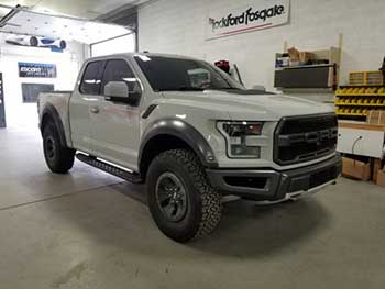 2017 Ford Raptor. Installed an Audison Bit Ten Processor with remote controller, a Hertz 5-channel amp. Custom built enclosure for a Kenwood 10" shallow sub with Kenwood speakers in the front and rear. All components are mounted behind the rear seat with no loss of space. Even the jack is still in its factory spot!