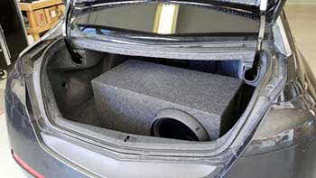 2009 Acura TL before and after photos of pre-fab box in the trunk. We custom built a bass enclosure to fit the trunk to house a Rockford sub and the mono amp.