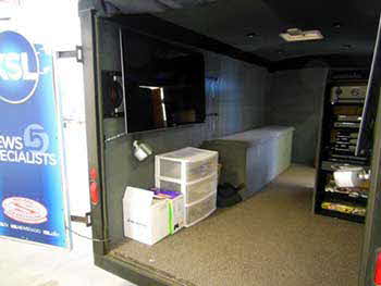KSL Trailer: Completely carpeted interior. Built custom cabinet for electronics, built storage bench & custom enclosure for subwoofer. Wired entire interior for TV's & sound system. Cut in water resistant plates on outside for speaker terminals.