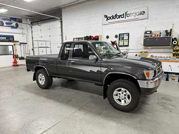1993 Toyota pickup. Converted the rear floor cargo bins into sub enclosures for Kenwood woofers. Rear side pockets converted to hold Excelon speakers . Hertz 4 speakers up front. All powered by a 5-channel amp.