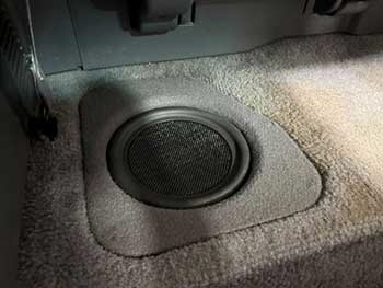 1993 Toyota pickup. Converted the rear floor cargo bins into sub enclosures for Kenwood woofers. Rear side pockets converted to hold Excelon speakers . Hertz 4 speakers up front. All powered by a 5-channel amp.