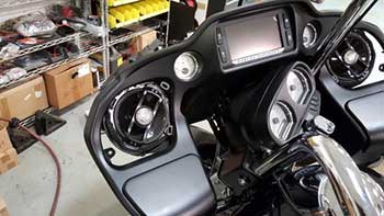 2015 Harley Road Glide.  Installed Rockford Fosgate: 2 pair marine speakers, 1 pair power 6" coax, 3 amps, 1 XS battery and 2 Kenwood  10" subs.   Custom built down fire sub box and trim panels for amps & battery in the bags.