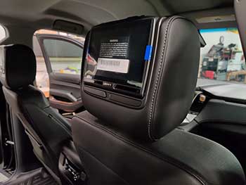 2018 Chevy Suburban. We installed 4 headrest monitors custom made for the vehicle by Audiovox so the material, stitching and size of the bars that go into the seats are an exact match to the vehicle. These are the 8" touchscreens with an HDMI input