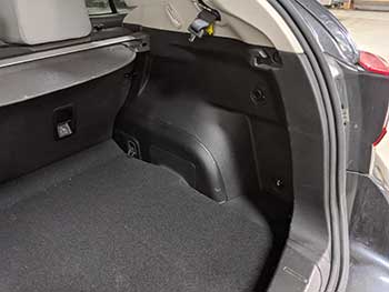 2019 Subaru Crosstek. Custom fabricated side panel enclosure for a single 10" Kenwood subwoofer controlled by a Kenwood amplifier.